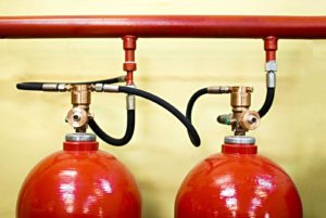 two red fire suppression tanks